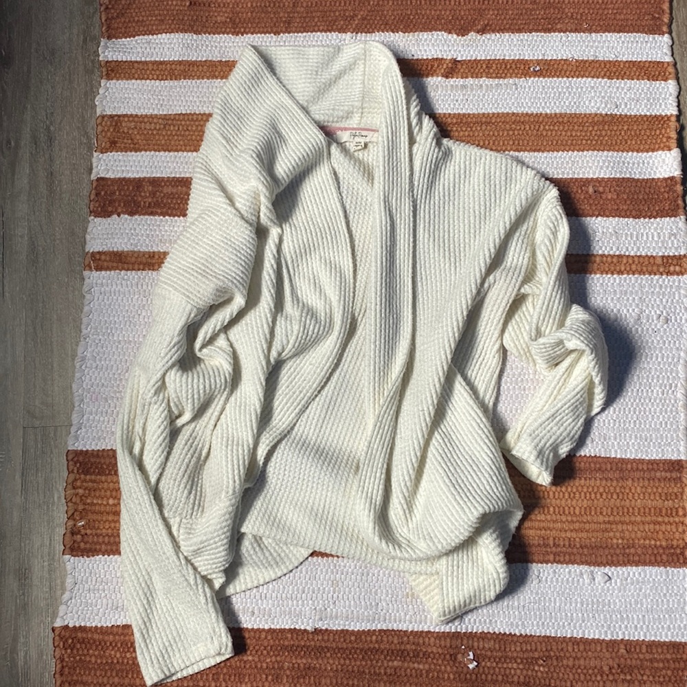This is a cute white breezy sweater.